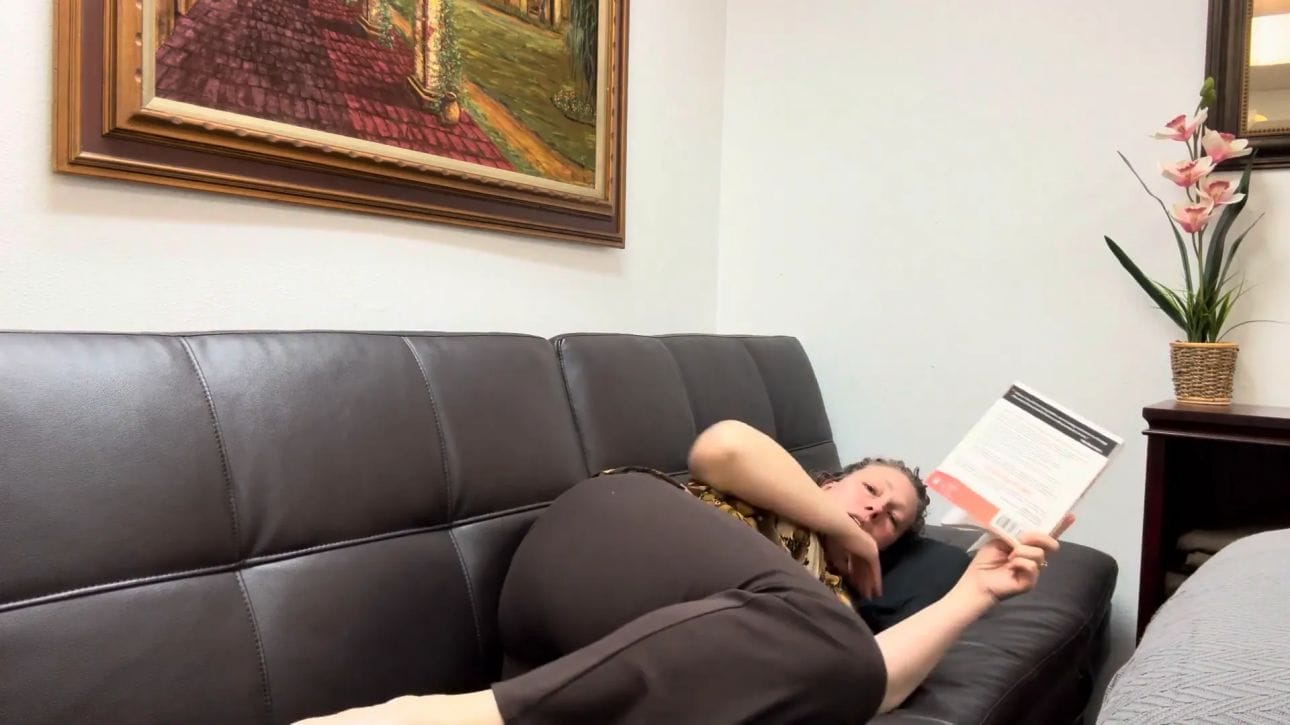 Side-lying reading with head supported by a pillow