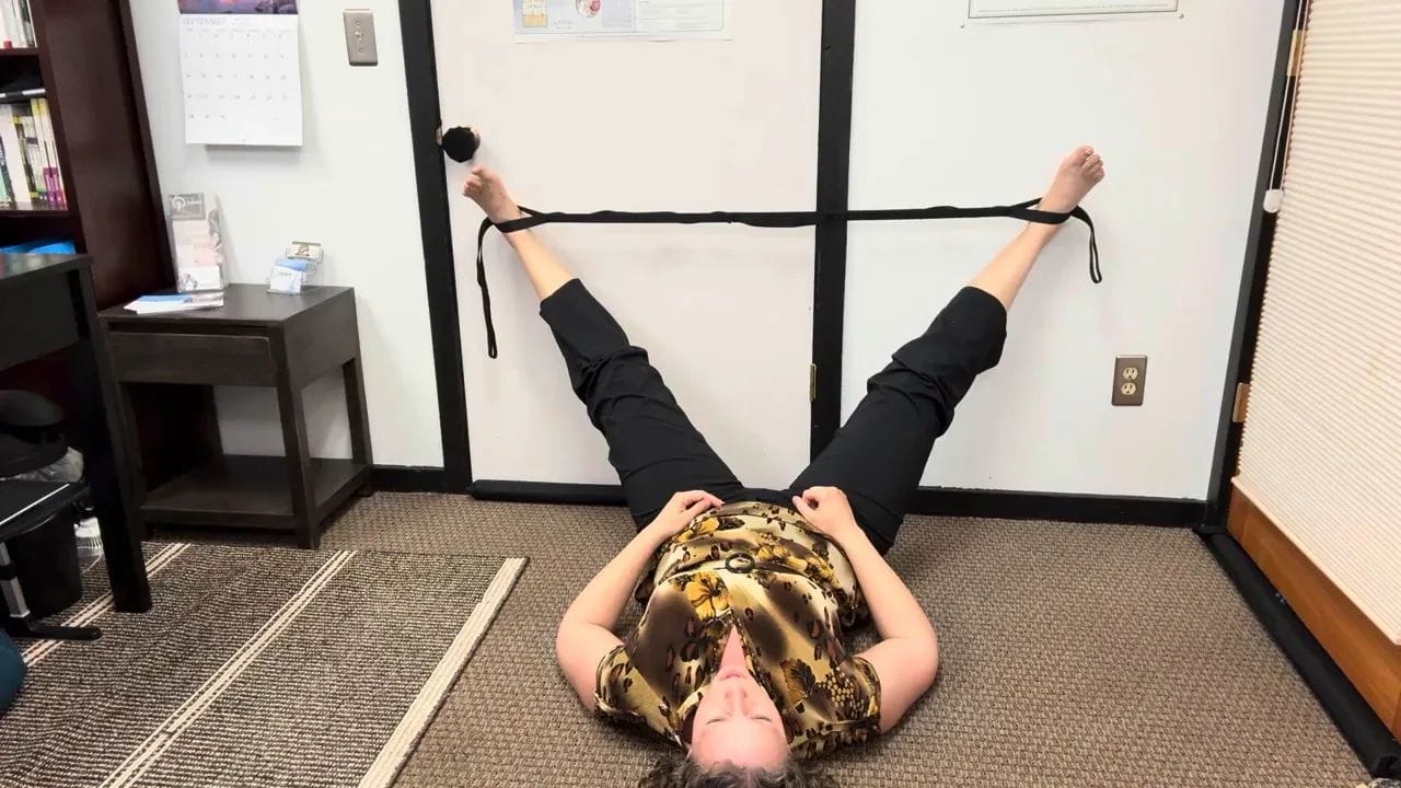 Feet in the strap with low back supported, legs opening